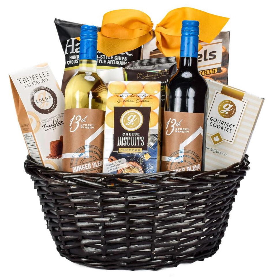 Canadian Cabernet And Chardonnay Wine With Cheddar Cookies, Chips, Pretzels, Truffles, And Shortbread Cookies in Brown Wicker Basket