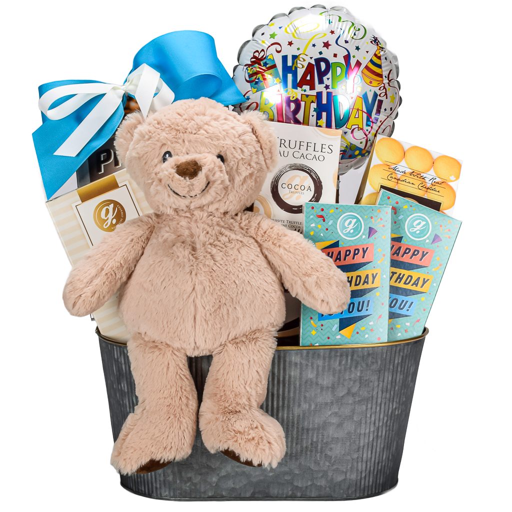 Brown Teddy Bear In Silver Basket With Birthday Balloon, Birthday Milk Chocolate, Pretzels, Truffles, Popcorn And Cheddar Cookies With A Blue Bow