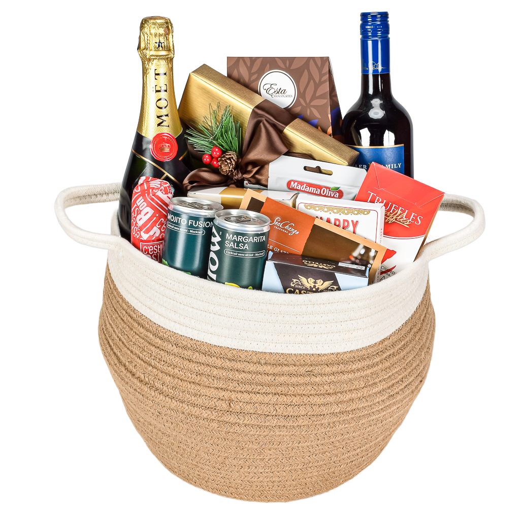 Moet Champagne 750mL Bottle With Red Canadian Made Wine In a Two tone Jute Basket With Chocolates, Mocktails, Chocolate, Tuffles, Cookies, Salami And Many More Goodies. 