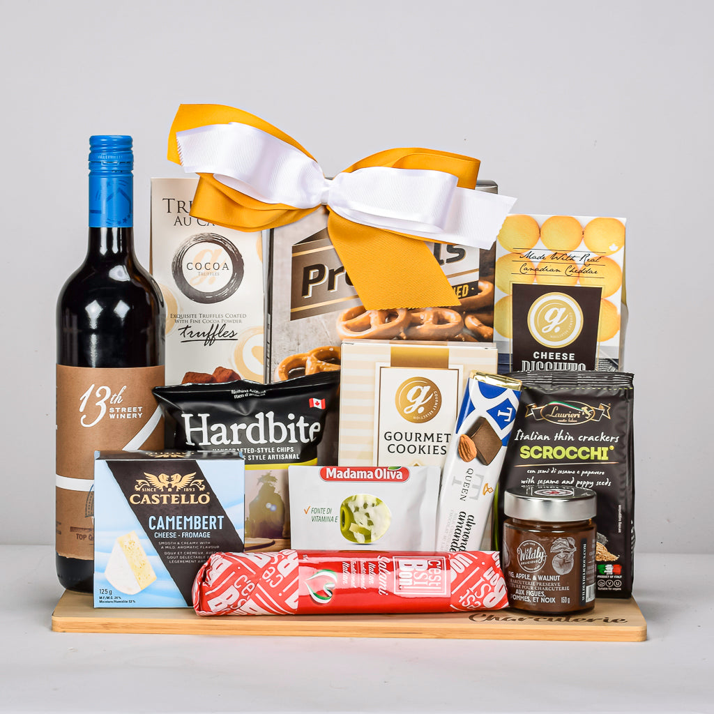 Charcuterie Board With Meats Cheese, Crackers, Chocolate, Cookies, And Red VQA Wine