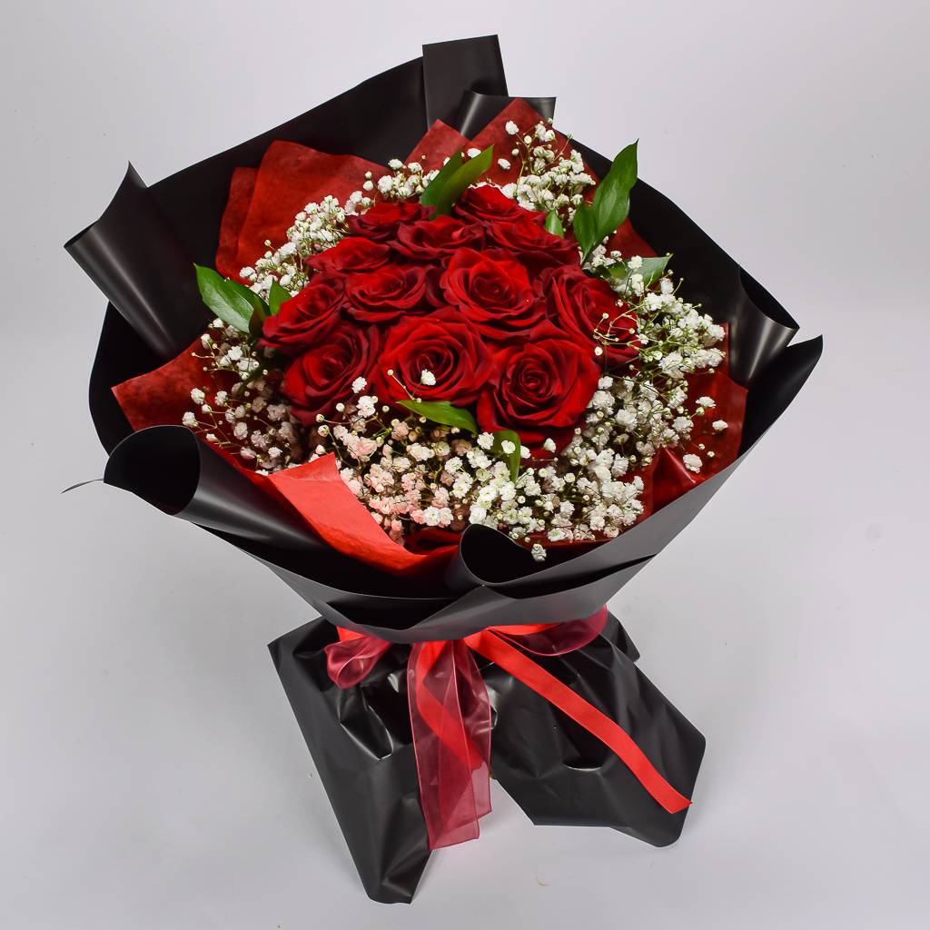 A Dozen Red Roses With Black Korean Wrapping Paper