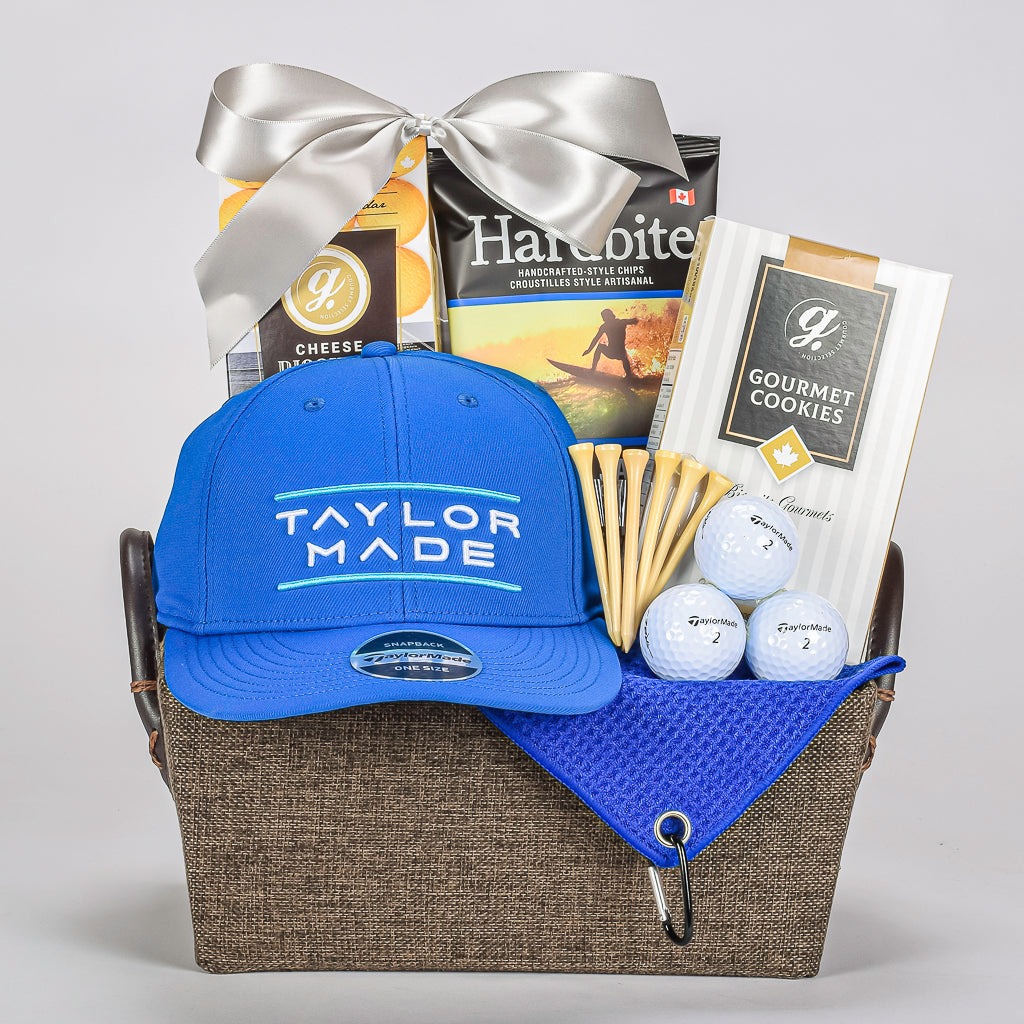 Golf Taylor Made Hat, Tees, Balls, Shortbread Cookies, Chips And And Cheddar Biscuits In a Brown Basket