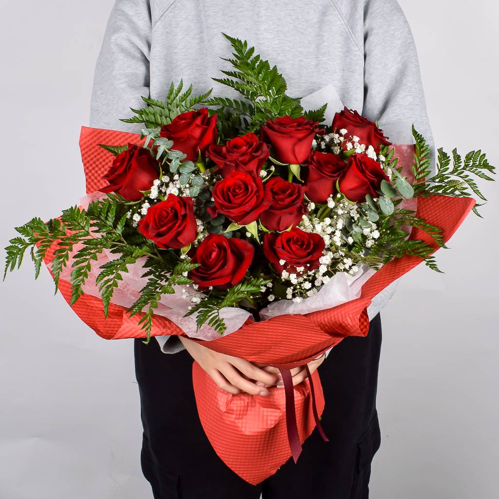 Beautiful Ruby Red Roses Hand Wrapped In Red Textured Floral Paper