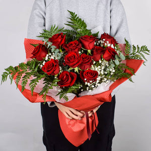 Beautiful Ruby Red Roses Hand Wrapped In Red Textured Floral Paper