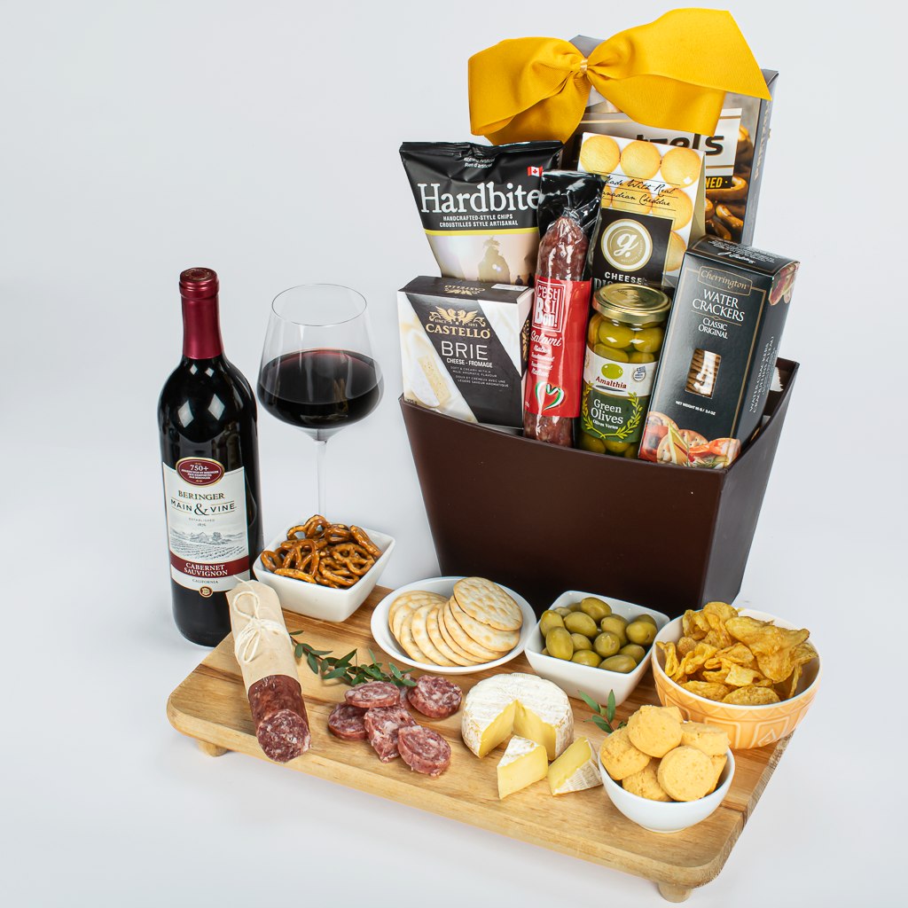 Red Canadian Wine With Sausage, Brie, Olives, Crackers, Cookies And Chips