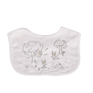 Baby bib with tree and rabbit design on a white background