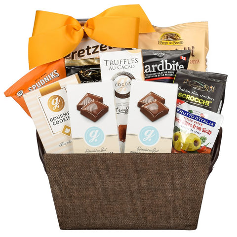 Fabric gift bsket with cookies, chocolates, olives, pretzels and sweets with a gold bow