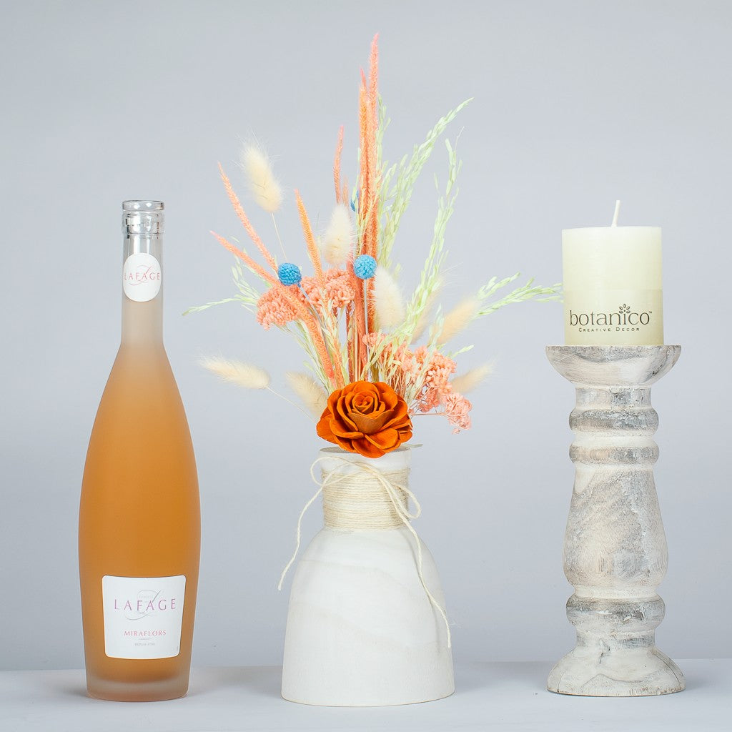 Housewarming gift with LaFage Rose Wine, dried flower bouquet in a wooden vase, decorative non scented candle and wooden candle holder
