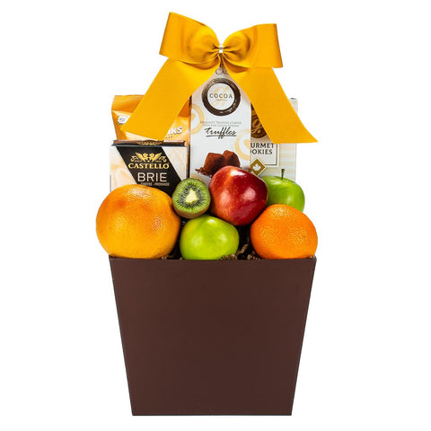 Brown gift basket of fruit with green apples, oranges, grapfruit, kiwi, brie cheese , crackers and truffles